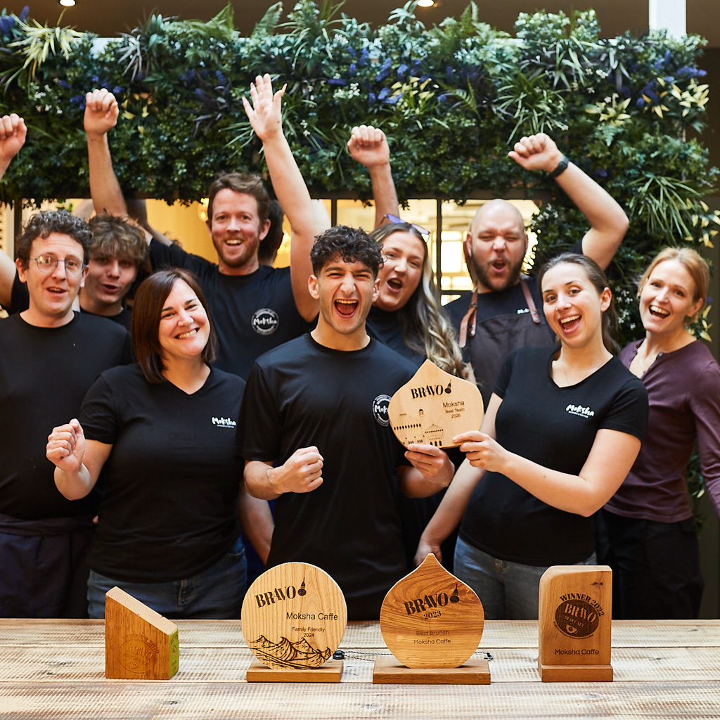 The team from Moksha Caffe in Brighton holding a BRAVO award trophy