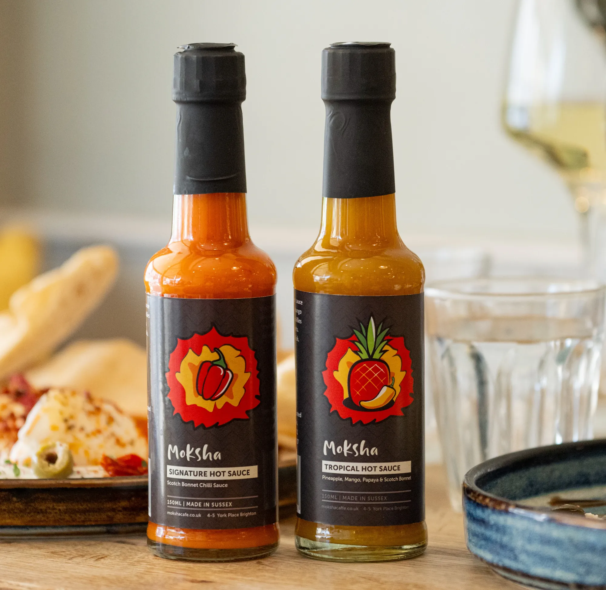 Moksha chilli sauces served in the café — Signature Scotch bonnet and Tropical fruit hot sauce