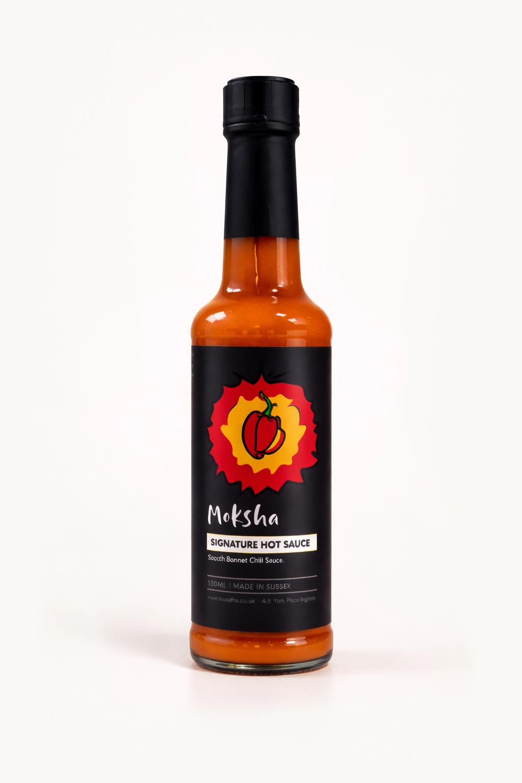 Bottle of Moksha Signature Hot Sauce, a Scotch bonnet chilli sauce